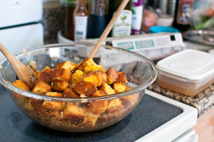 Mixing cornbread stuffing together