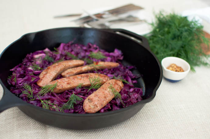 Pan-seared sausages with balsamic apple-cider cabbage